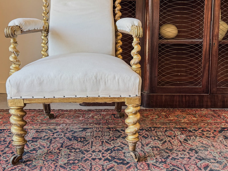 A Mid 19th Century Giltwood Open Armchair