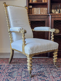 A Mid 19th Century Giltwood Open Armchair