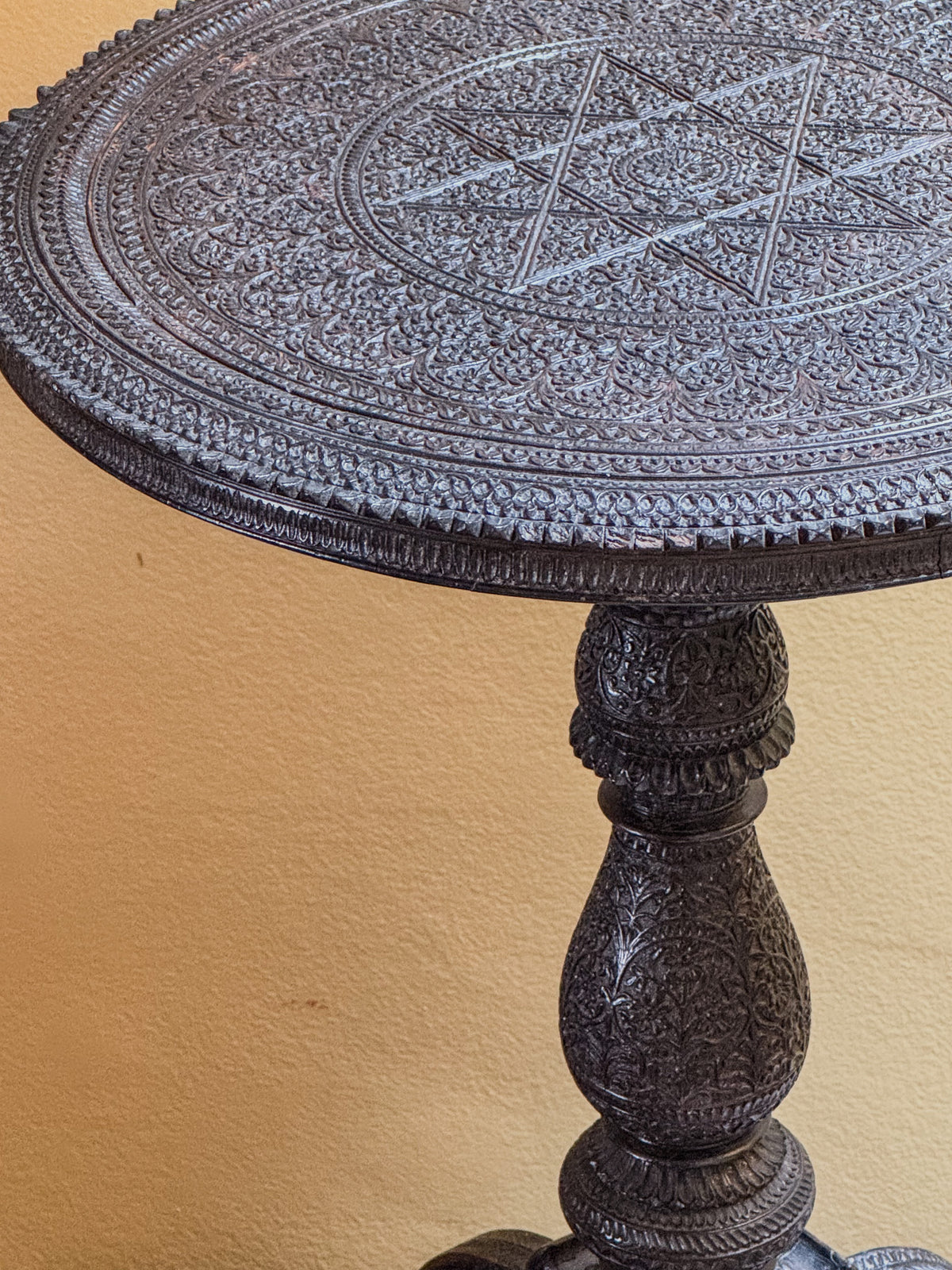 A Mid 19th Century Anglo Indian Ebony Carved Table