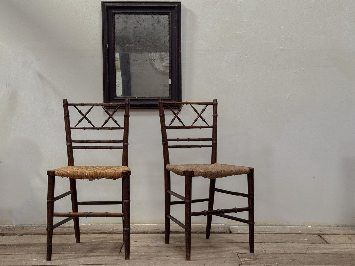A Pair of Regency Faux Bamboo Rush Seated Chairs