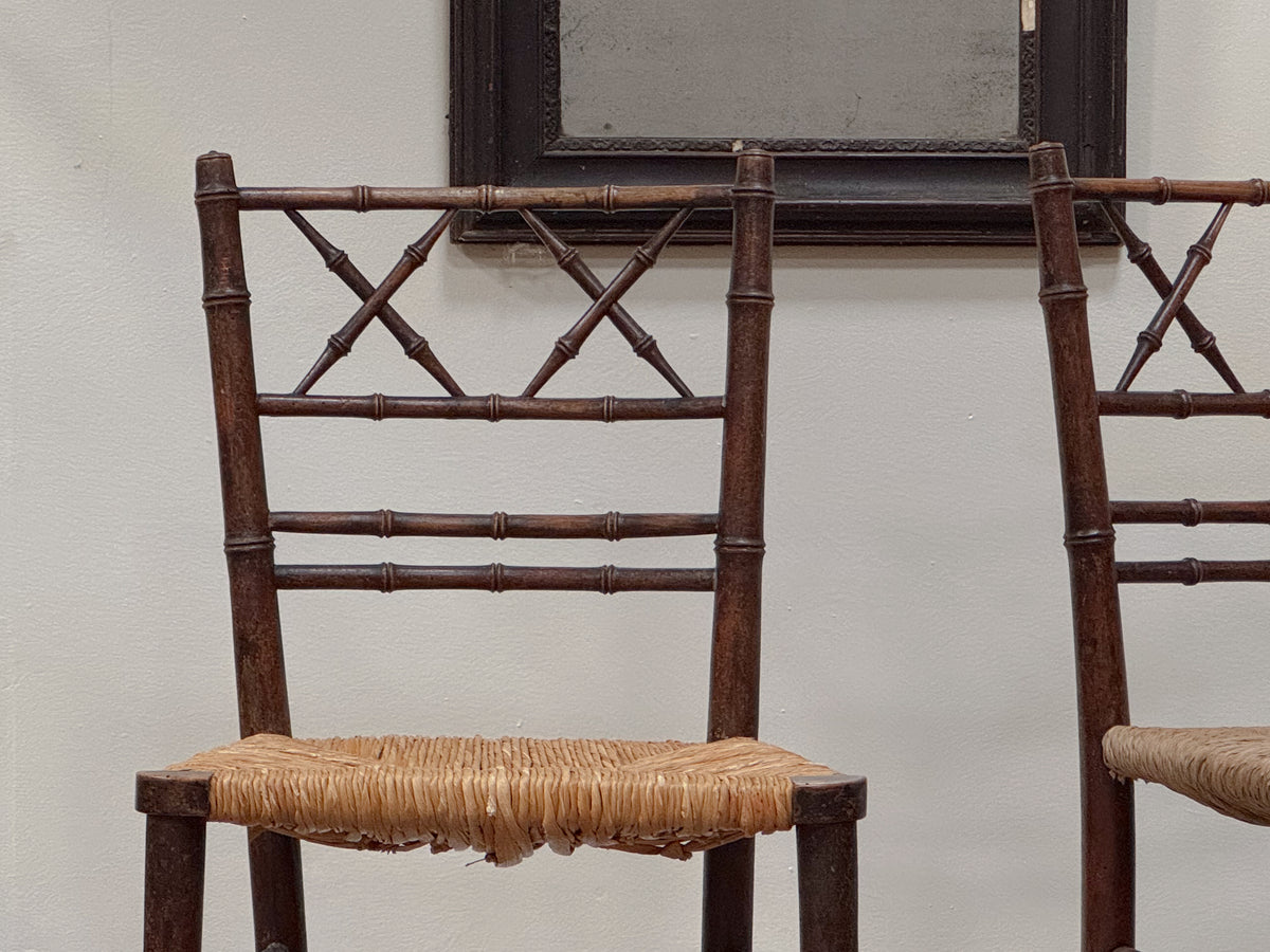 A Pair of Regency Faux Bamboo Rush Seated Chairs