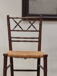 A Pair of Regency Faux Bamboo Rush Seated Chairs