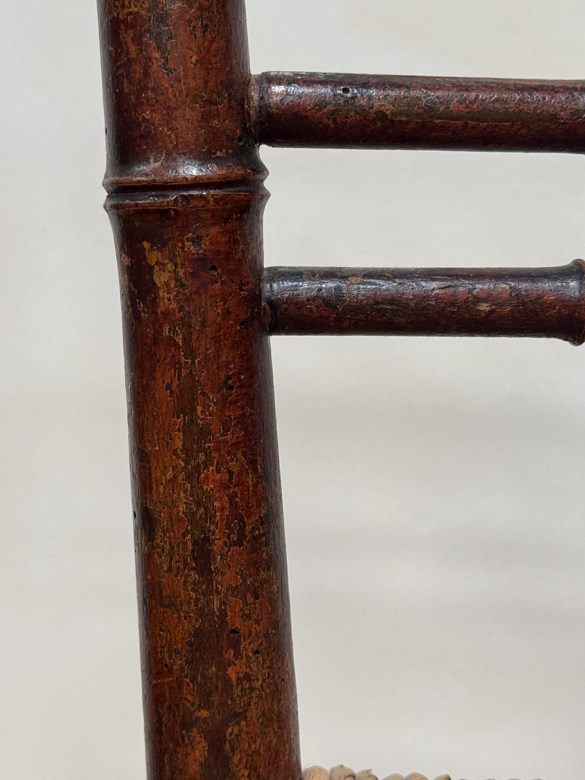 A Pair of Regency Faux Bamboo Rush Seated Chairs