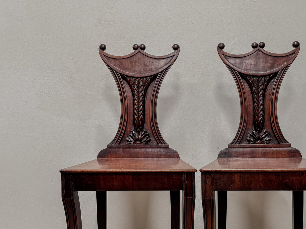 A Pair of Regency Mahogany 'Pelta' Back Hall Chairs in the manner of Gillows