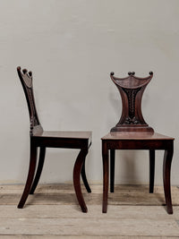 A Pair of Regency Mahogany 'Pelta' Back Hall Chairs in the manner of Gillows