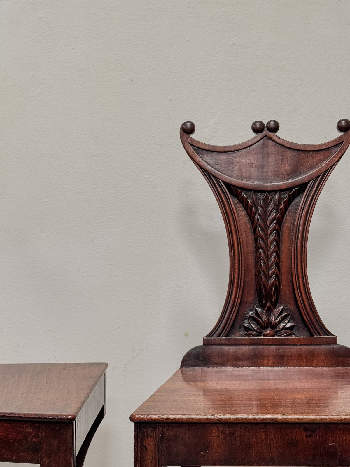 A Pair of Regency Mahogany 'Pelta' Back Hall Chairs in the manner of Gillows