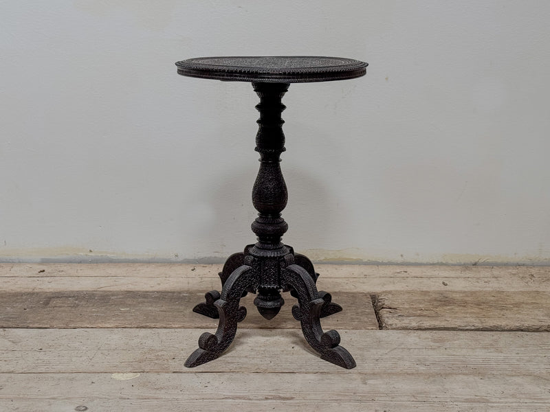 A Mid 19th Century Anglo Indian Ebony Carved Table