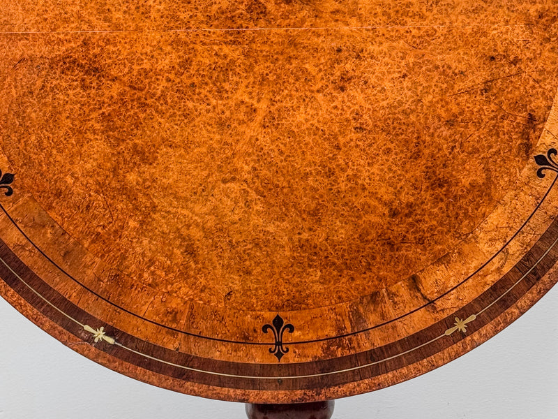A Regency Amboyna Centre Table in the manner of George Oakley (1760-1840)