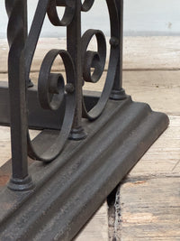 An Early 20th Century Wrought Iron Club Fender