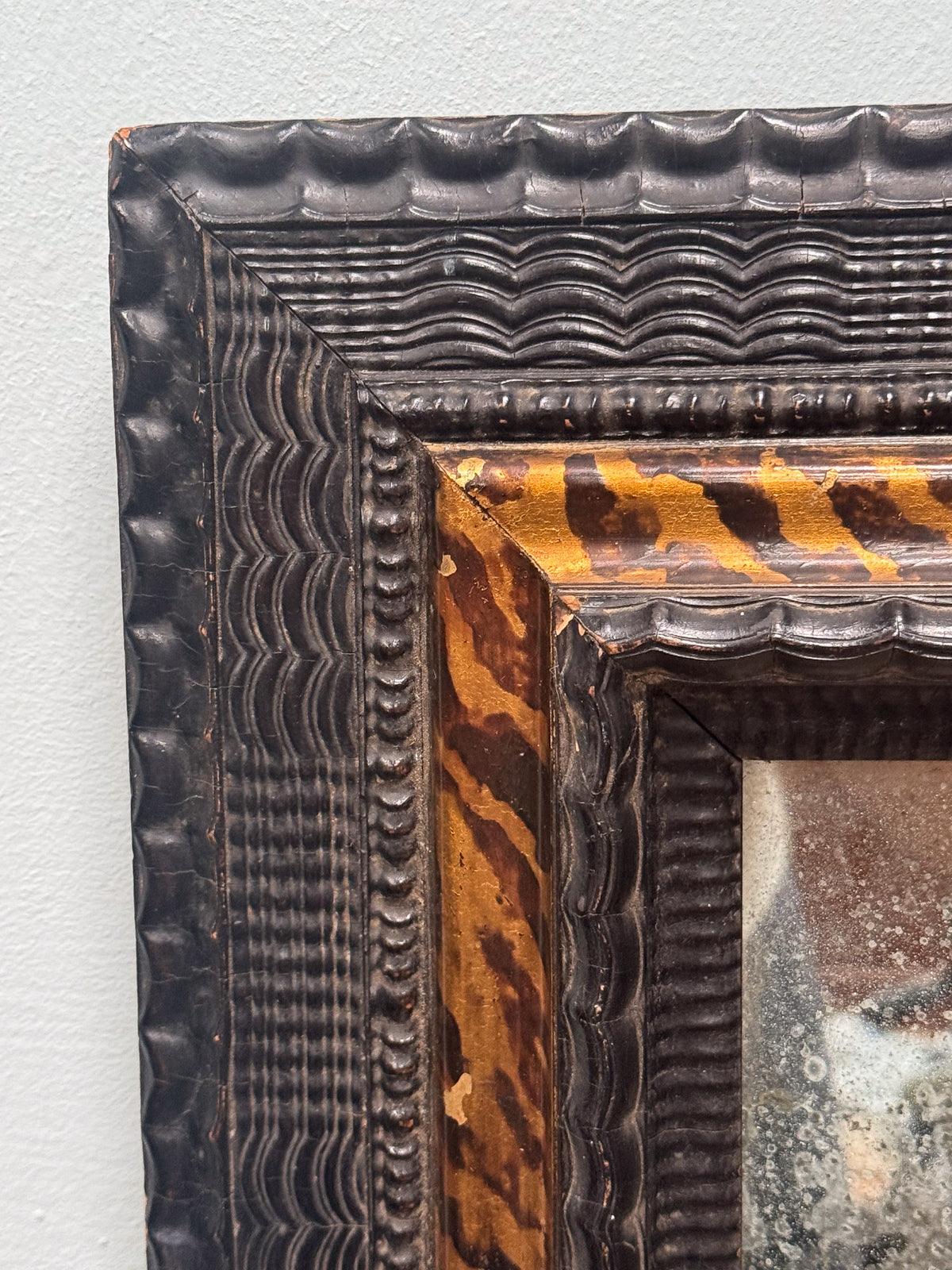 An Early 18th Century Dutch Ebony & Faux Tortoiseshell Ripple Frame Mirror