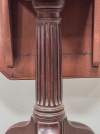 A George III Mahogany Table with Needlepoint