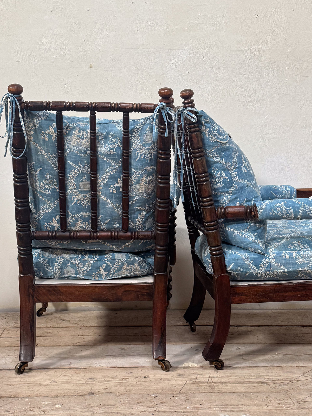 A Matched Pair of Mid 19th Century Simulated Rosewood Open Armchairs