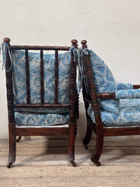 A Matched Pair of Mid 19th Century Simulated Rosewood Open Armchairs