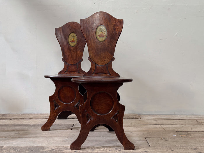 A Pair of George III Mahogany Sgabello Hall Chairs