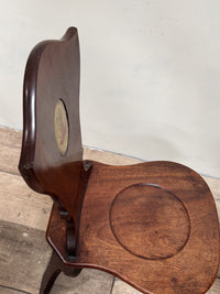 A Pair of George III Mahogany Sgabello Hall Chairs