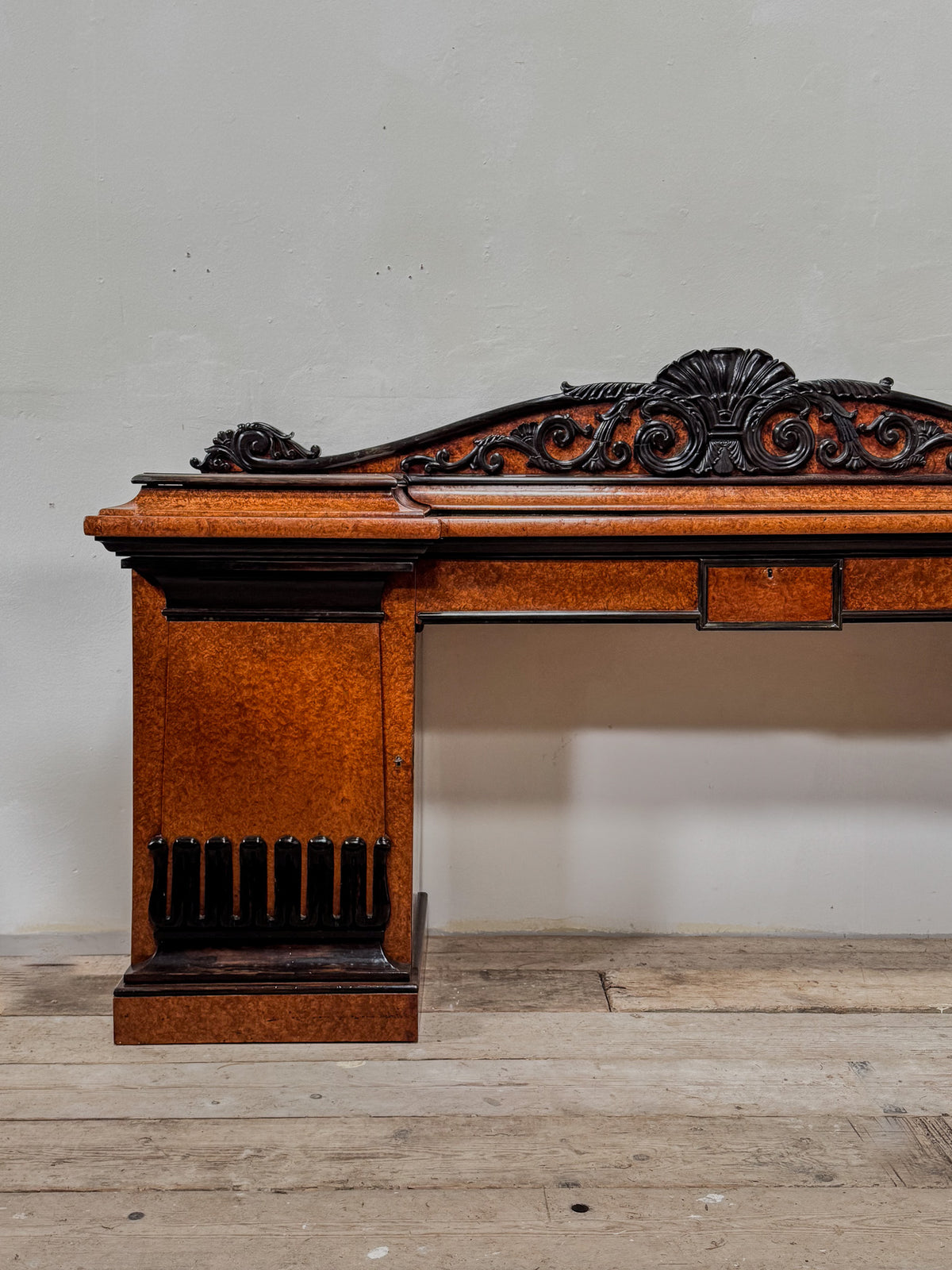 A Late Regency Amboyna & Ebony Pedestal Side Board
