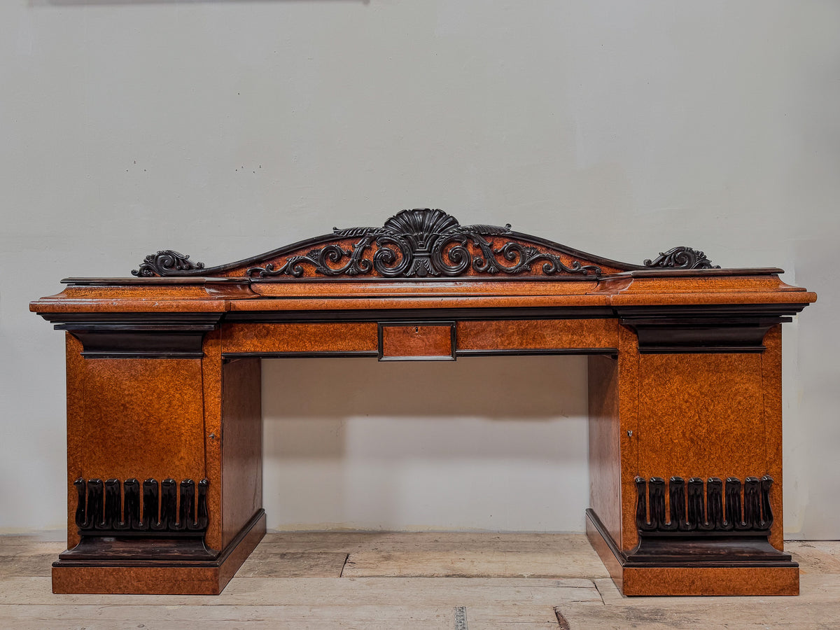 A Late Regency Amboyna & Ebony Pedestal Side Board