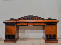 A Late Regency Amboyna & Ebony Pedestal Side Board