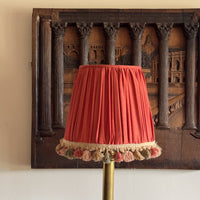 A Persimmon Silk  and Pom Pom Fringe Shade